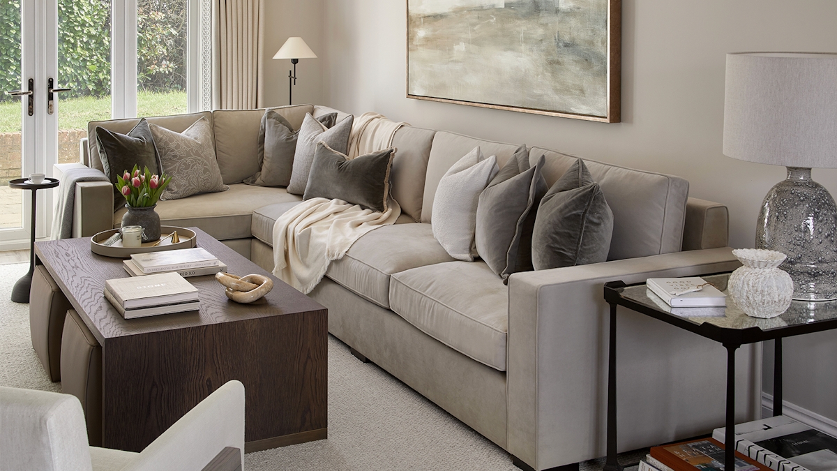 Modern country style living room with Rosedale Velvet Corner Sofa and Adelaide Wrap Coffee Table by LuxDeco and neutral colour cushions