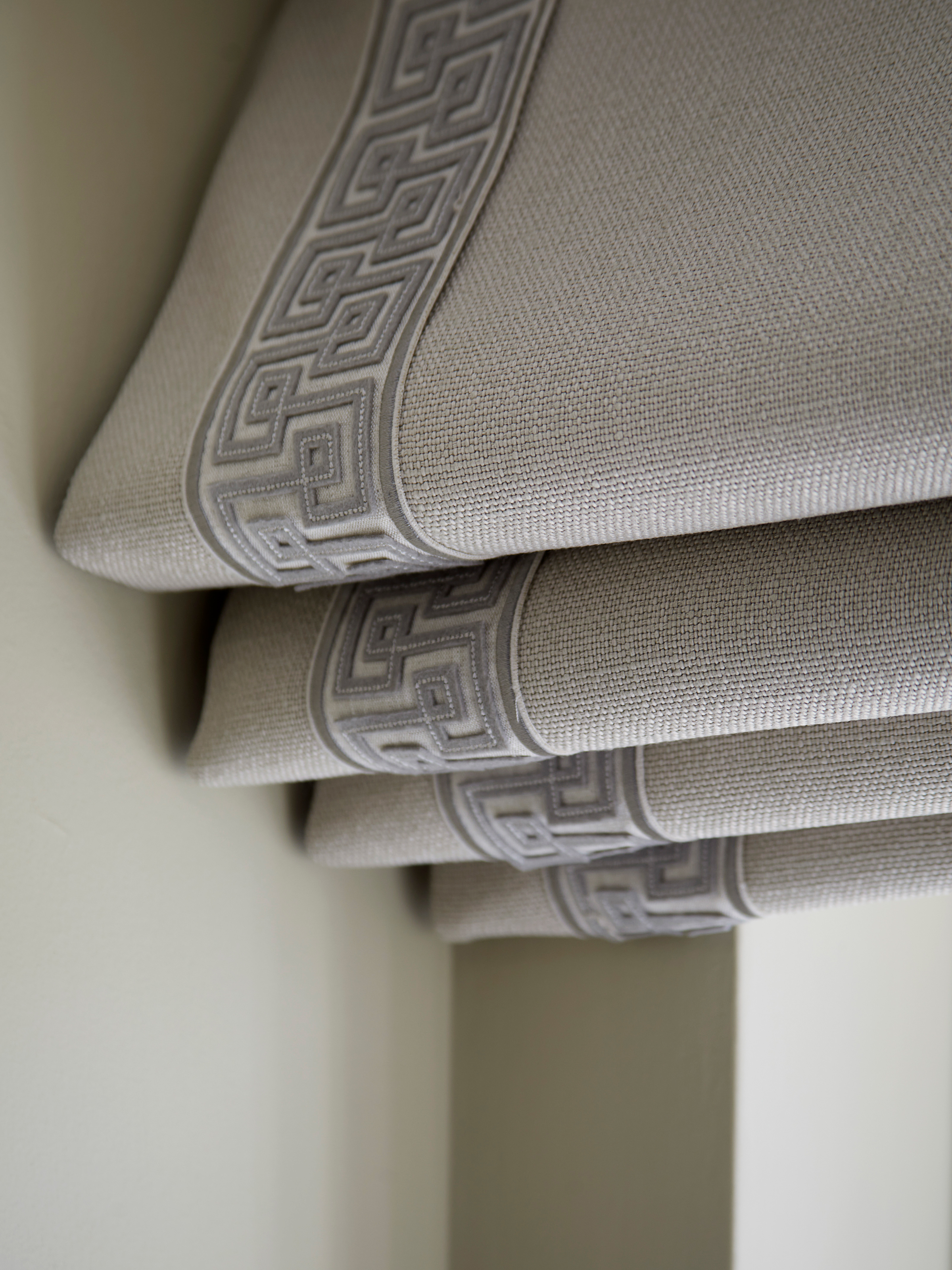 Textural grey detailing on roman blinds