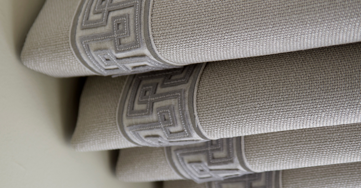 Textural grey detailing on roman blinds