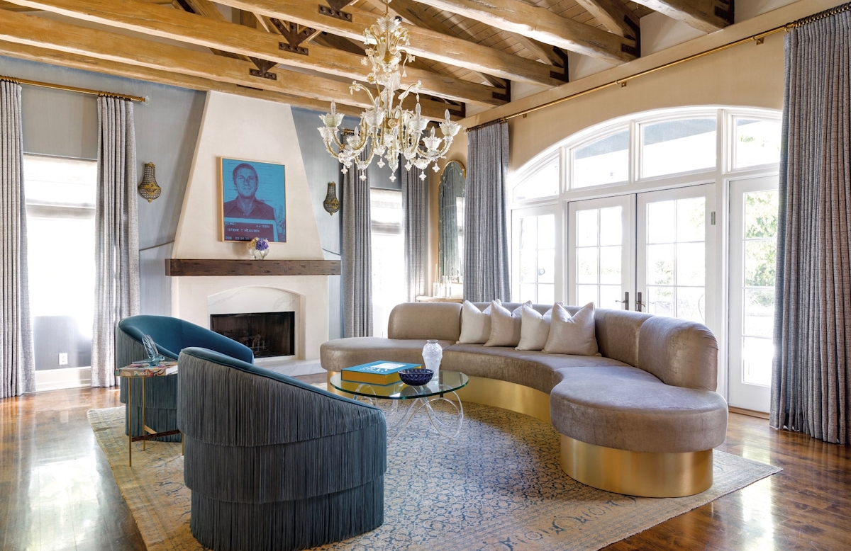Ryan Saghian | LA Living Room | Curved Sofa | Fringed Armchairs | Read more on the LuxDeco.com Style Guide