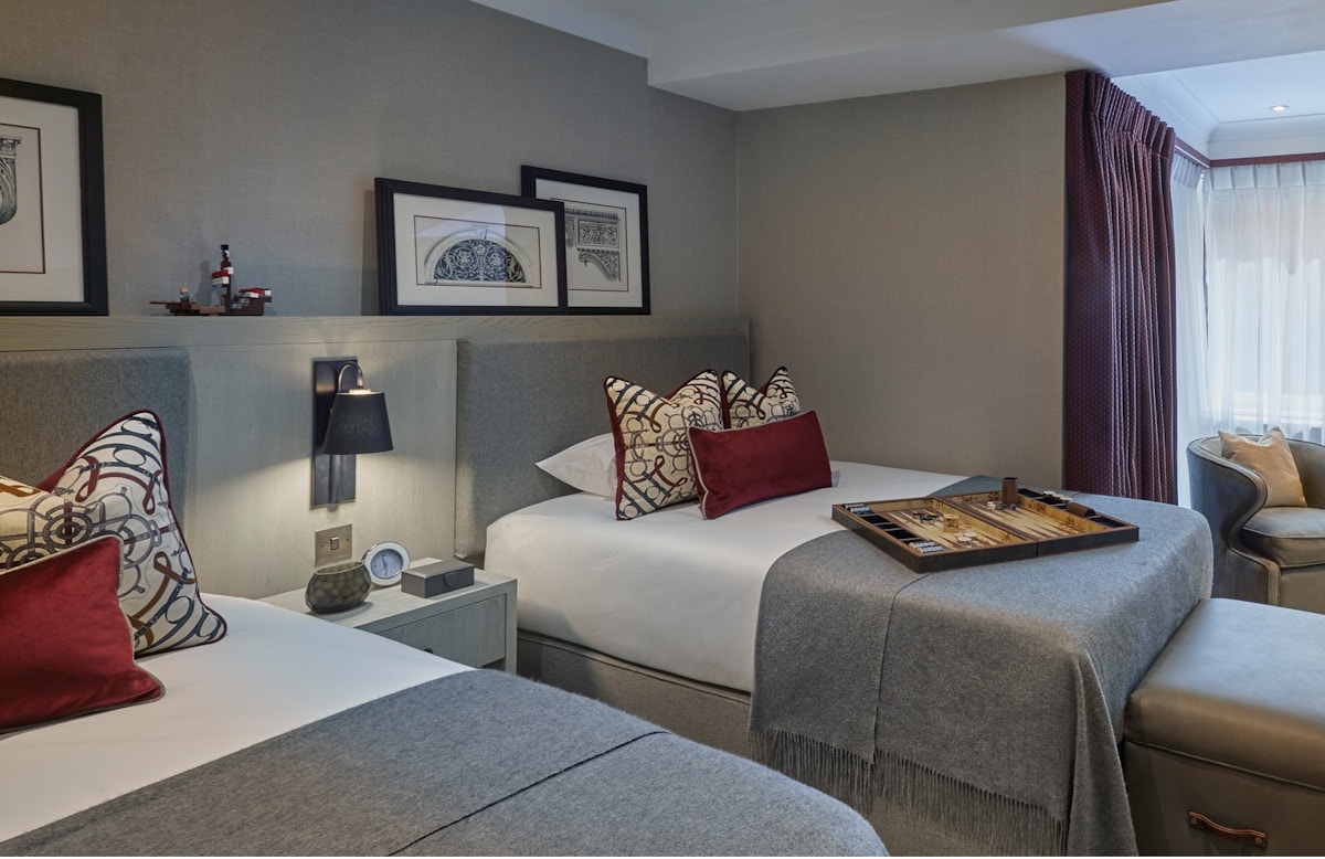 Luxury Red & Grey Bedroom | Regent's Park Apartment | Shop the look at LuxDeco.com