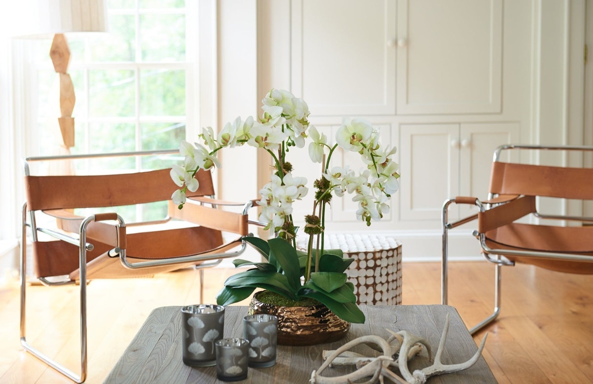 Beautiful Faux Flowers For Your Living Room | Elegant Dining Room | Read more in the LuxDeco Style Guide