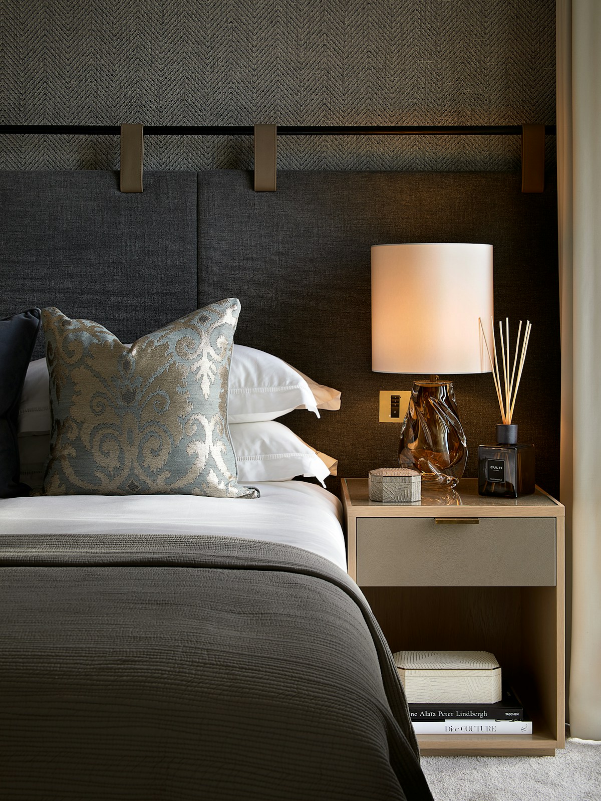 Luxury bedroom setting featuring the Laura Hammett Living collection's Elemental Ivory Coasters and Ivory Media Box