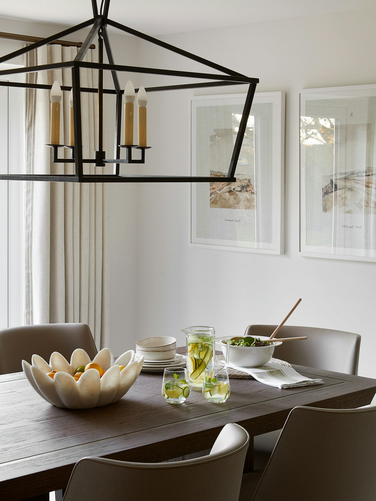 Inviting dining room table setting with Penton oak dining table by LuxDeco, Darlana lantern by Visual Comfort & Co. 