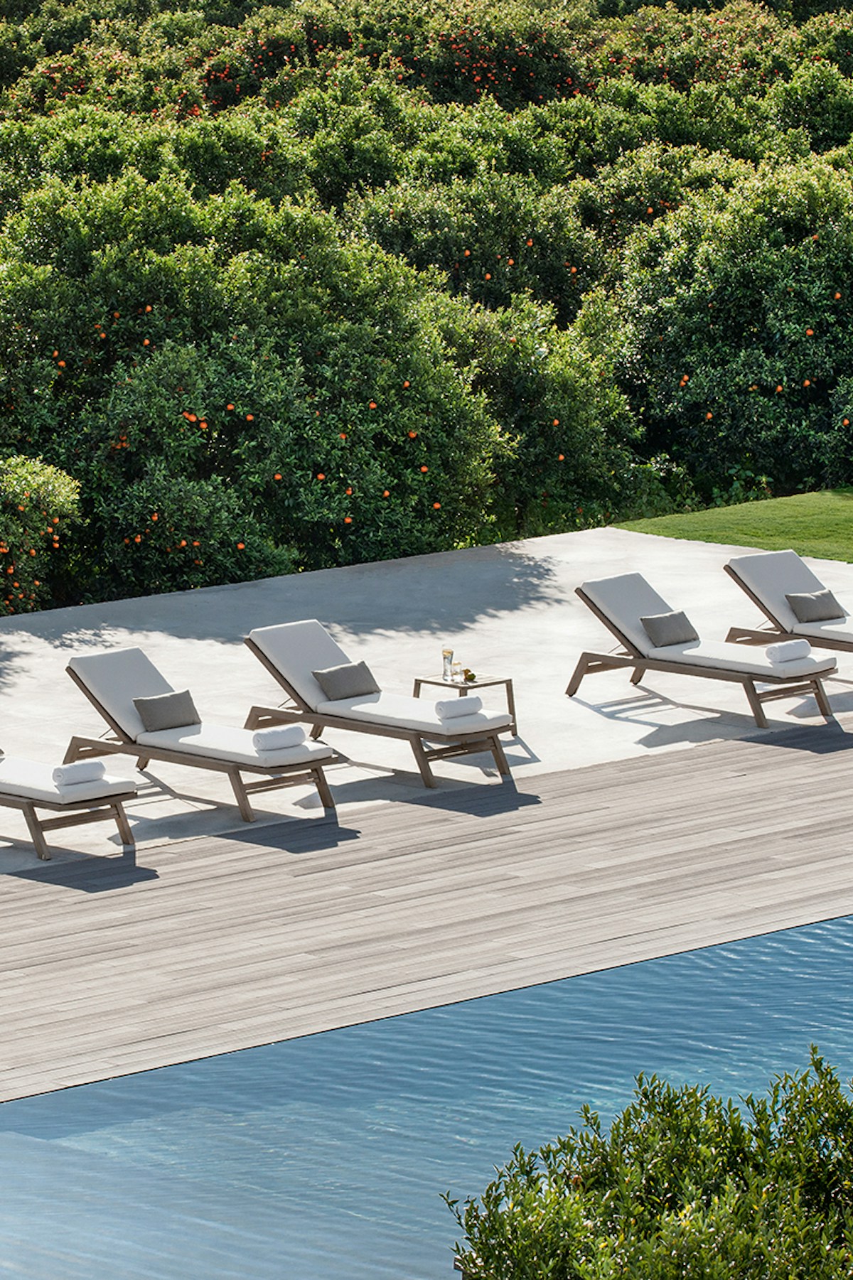 Ethimo Costes Outdoor Sunbed against Italian country setting