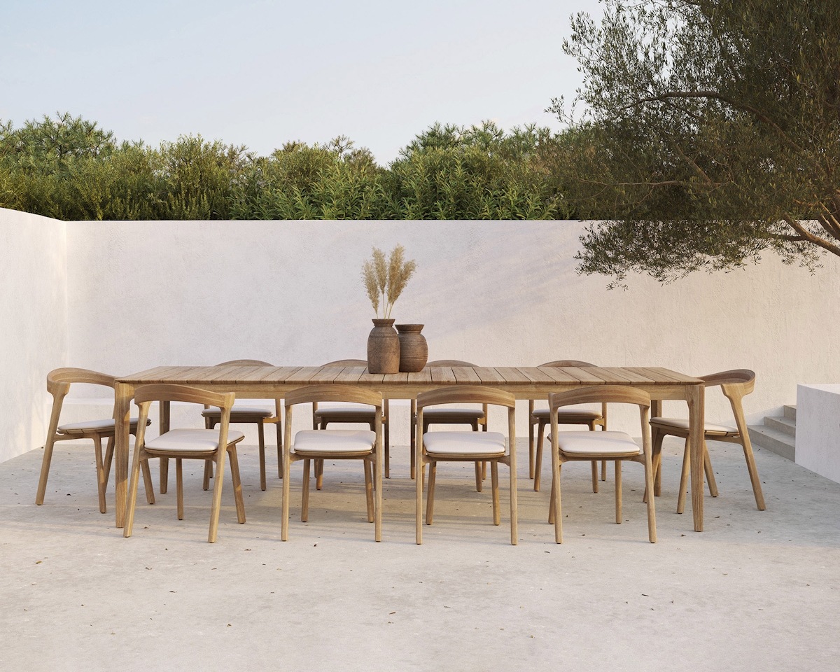 Ethimo large Bok teak outdoor dining table and chairs in minimalist outdoor setting with olive tree