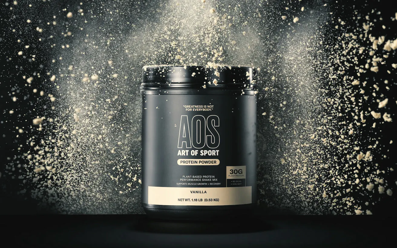 Art of Sport supplement tub in a burst of powder