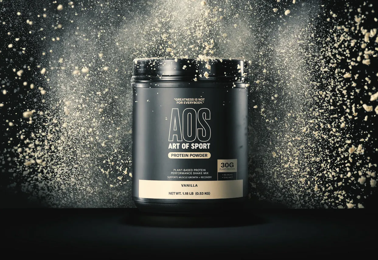 Art of Sport supplement tub in a burst of powder