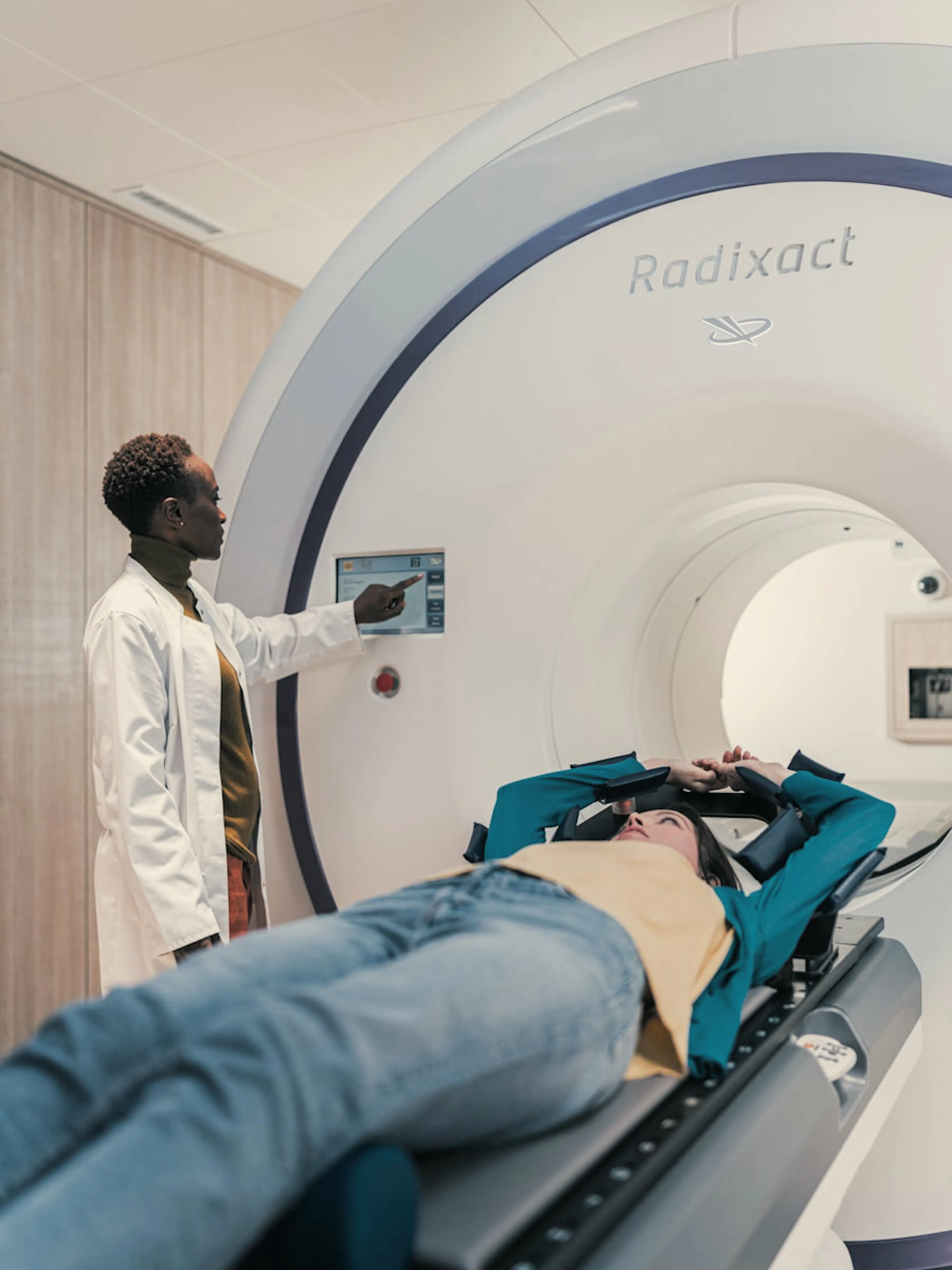 Clinician positioning a patient in a medical imaging scanner — Inari Medical