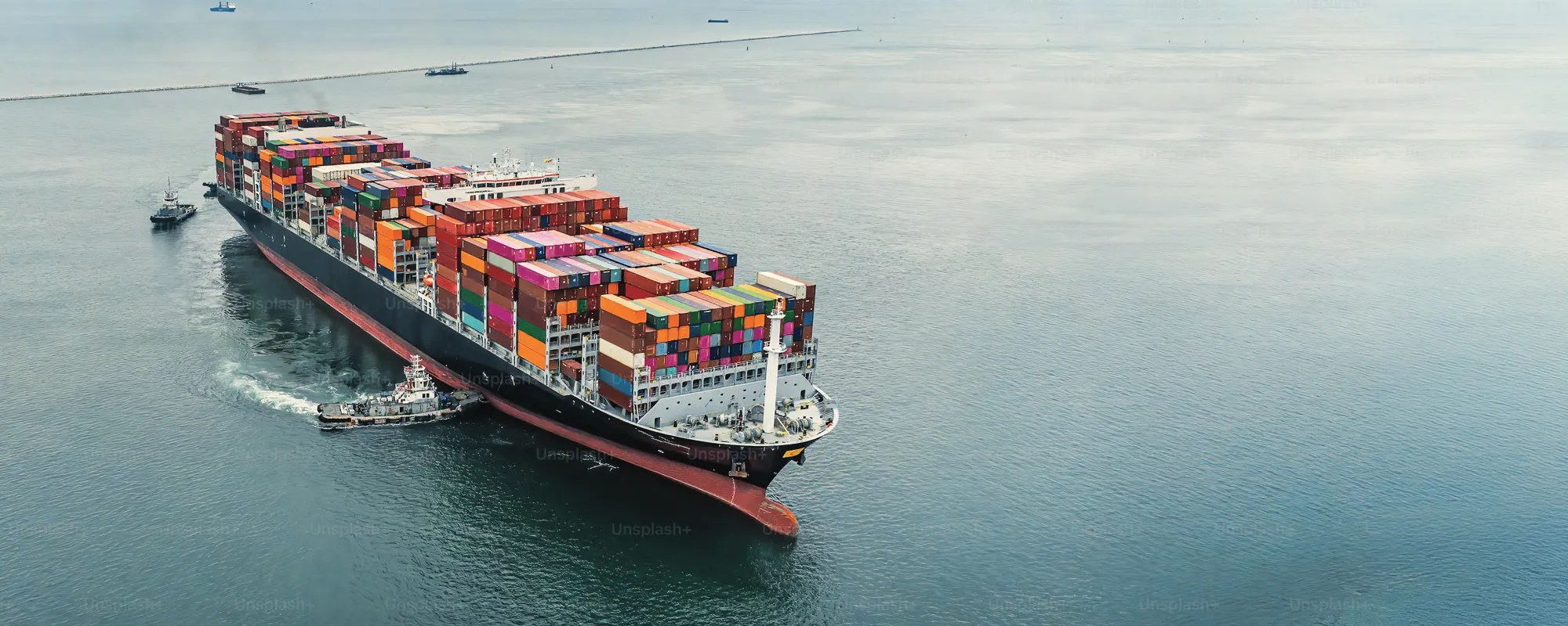 Aerial view of a fully loaded container ship at sea — Alliance Trading Group