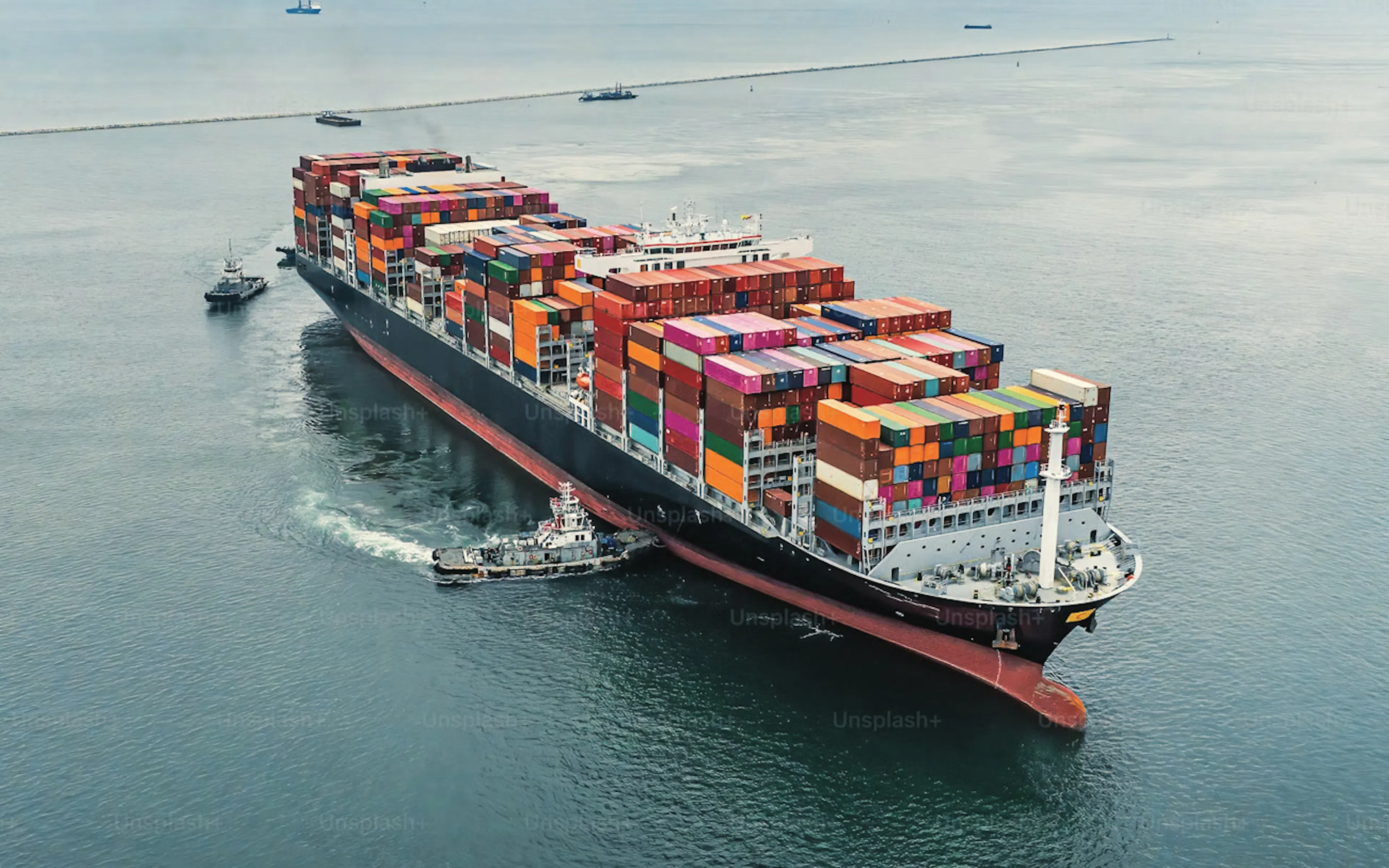 Aerial view of a fully loaded container ship at sea — Alliance Trading Group