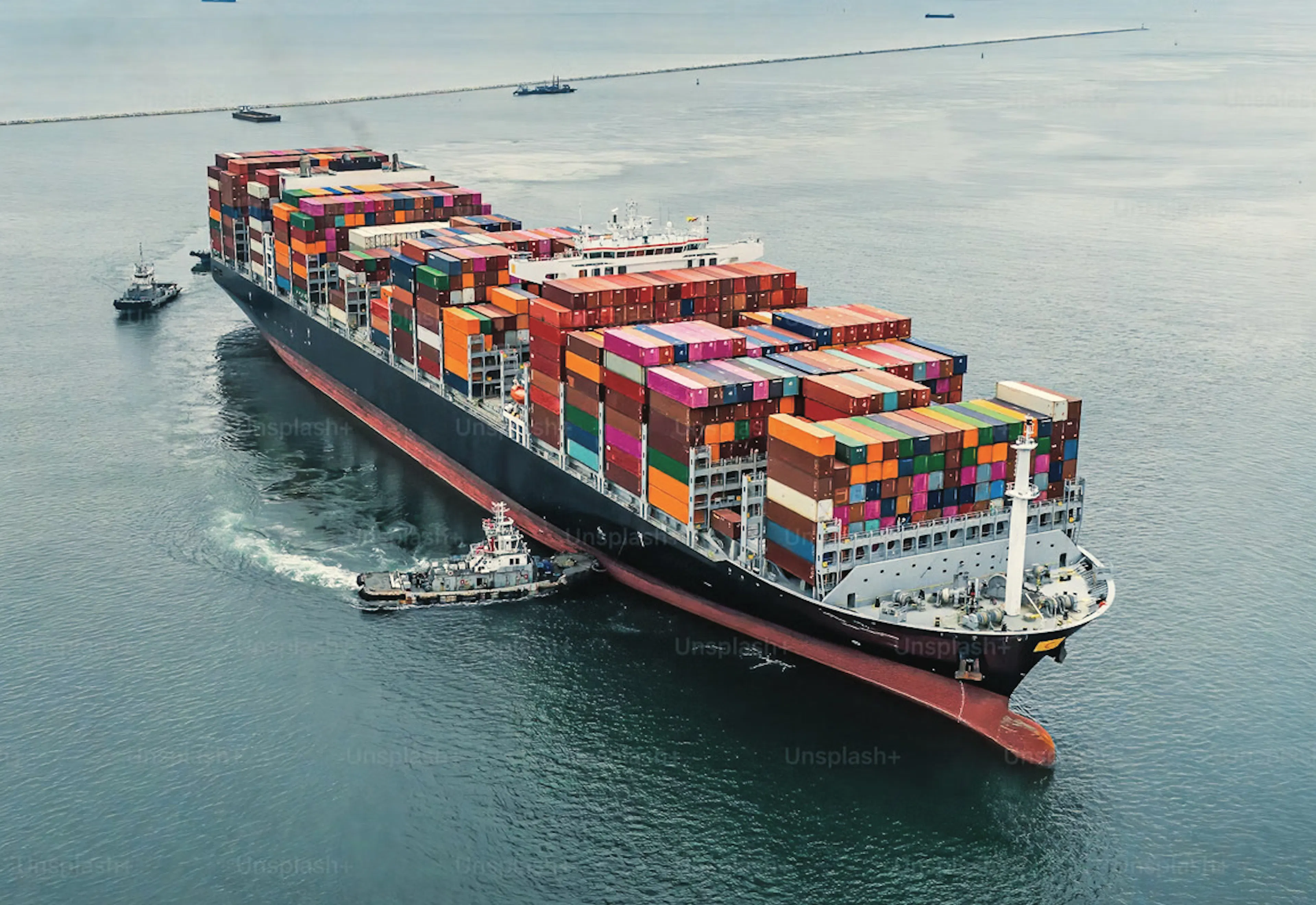 Aerial view of a fully loaded container ship at sea — Alliance Trading Group