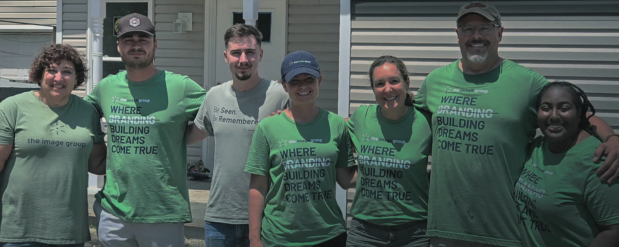 The Image Group team wearing branded green t-shirts