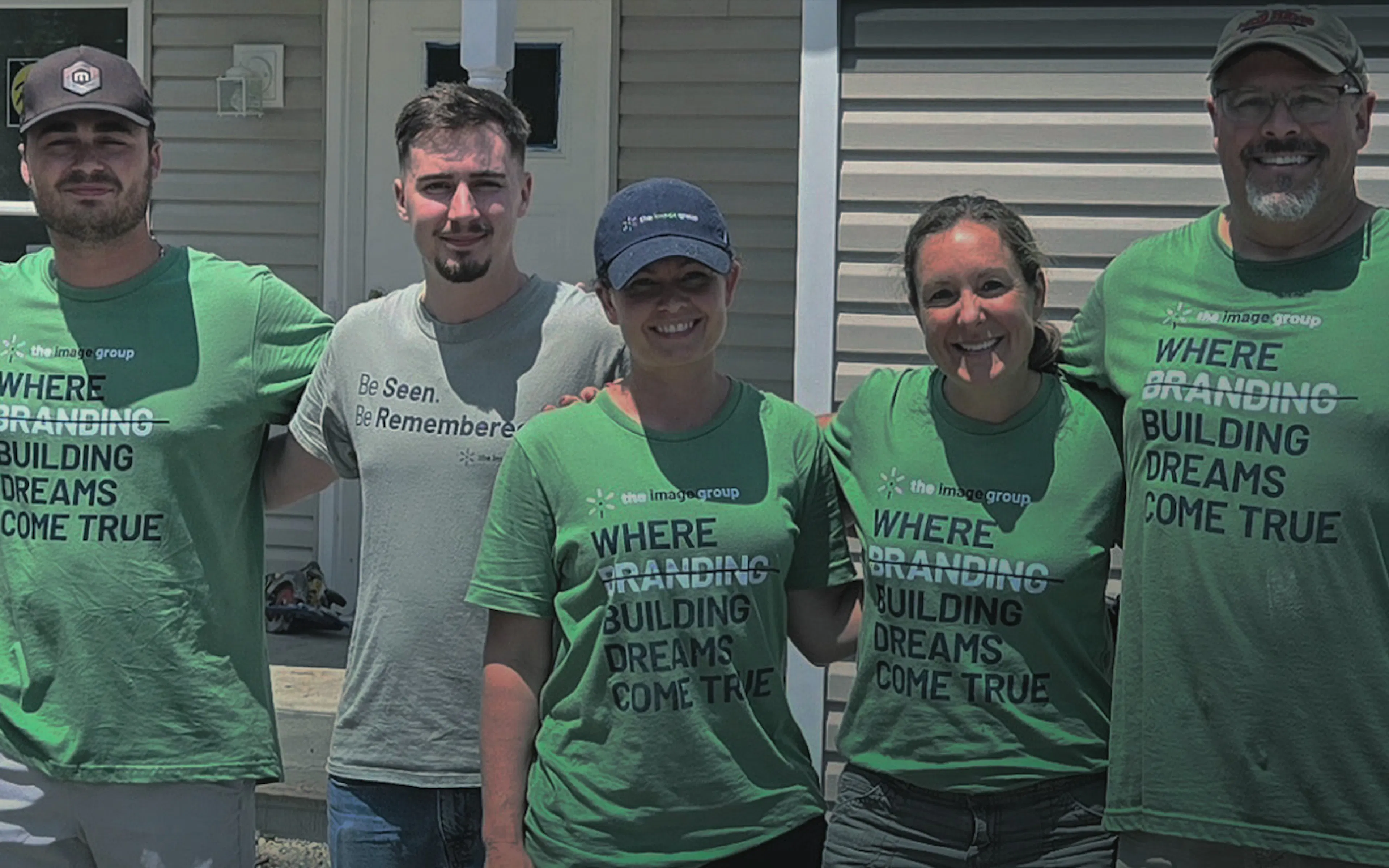 The Image Group team wearing branded green t-shirts