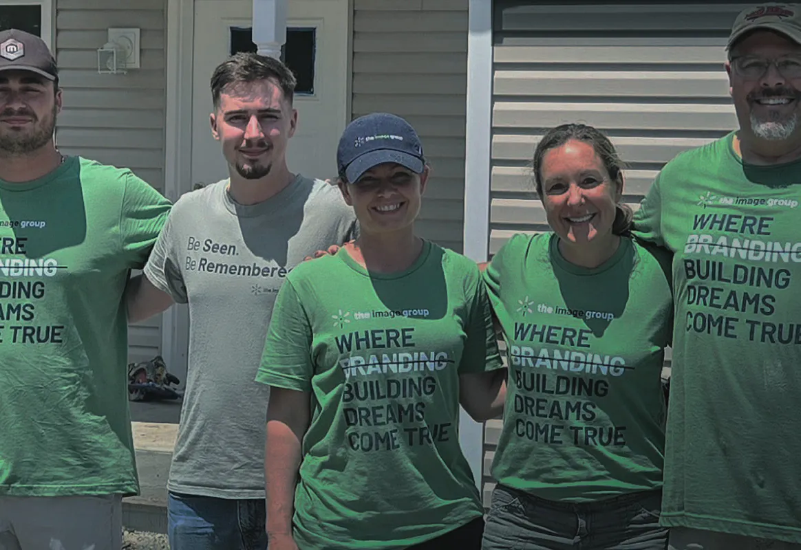 The Image Group team wearing branded green t-shirts