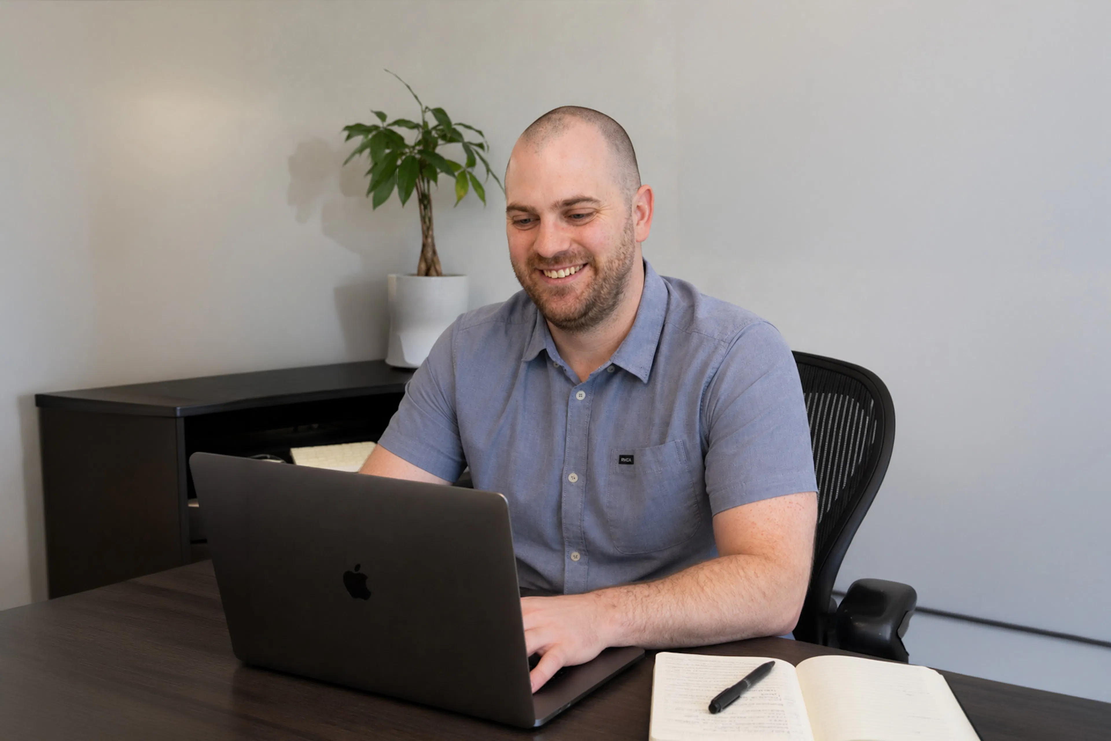 Luxent consultant working at a desk