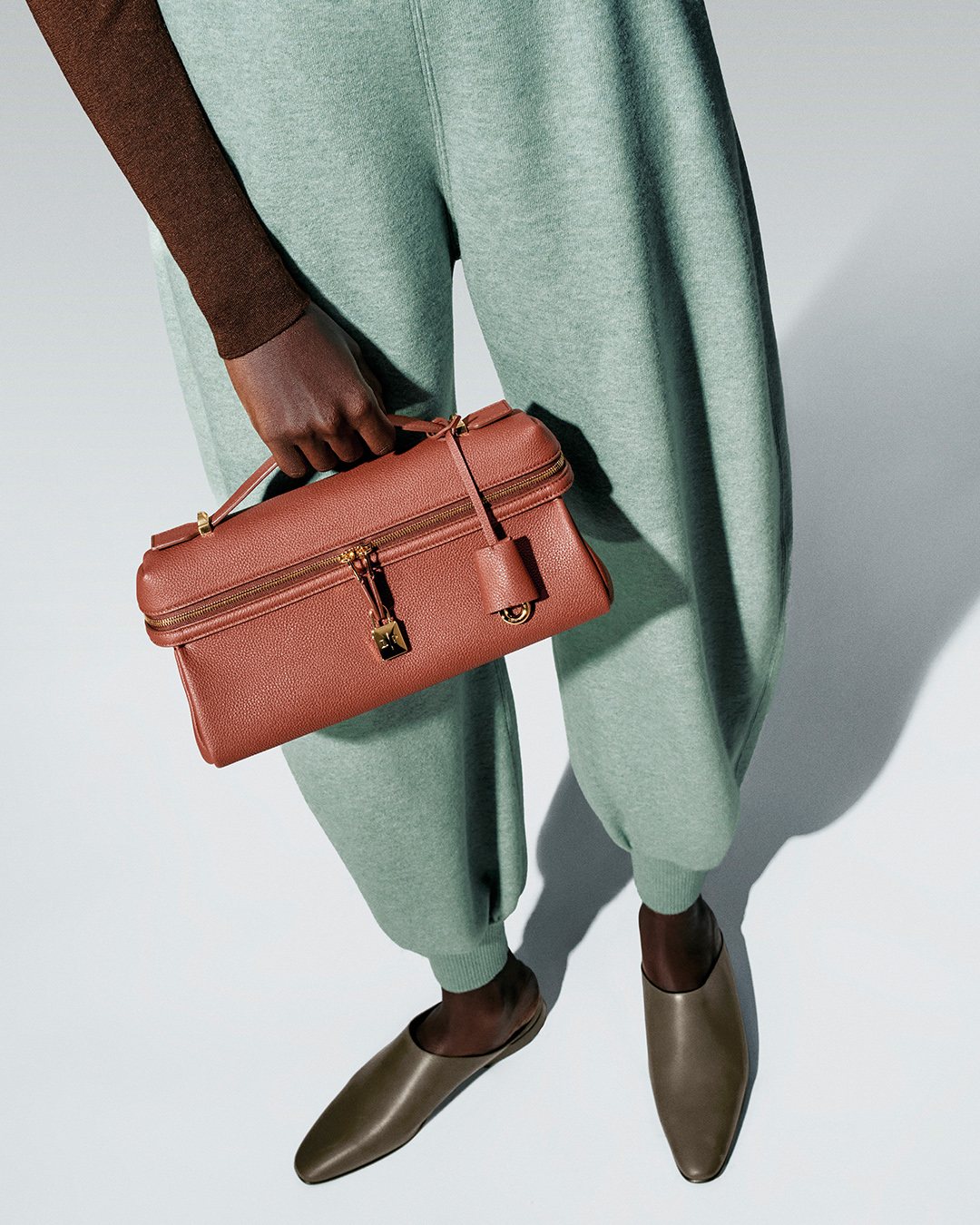 A full womenswear look from the Loro Piana collection showcasing its neutral color palette.