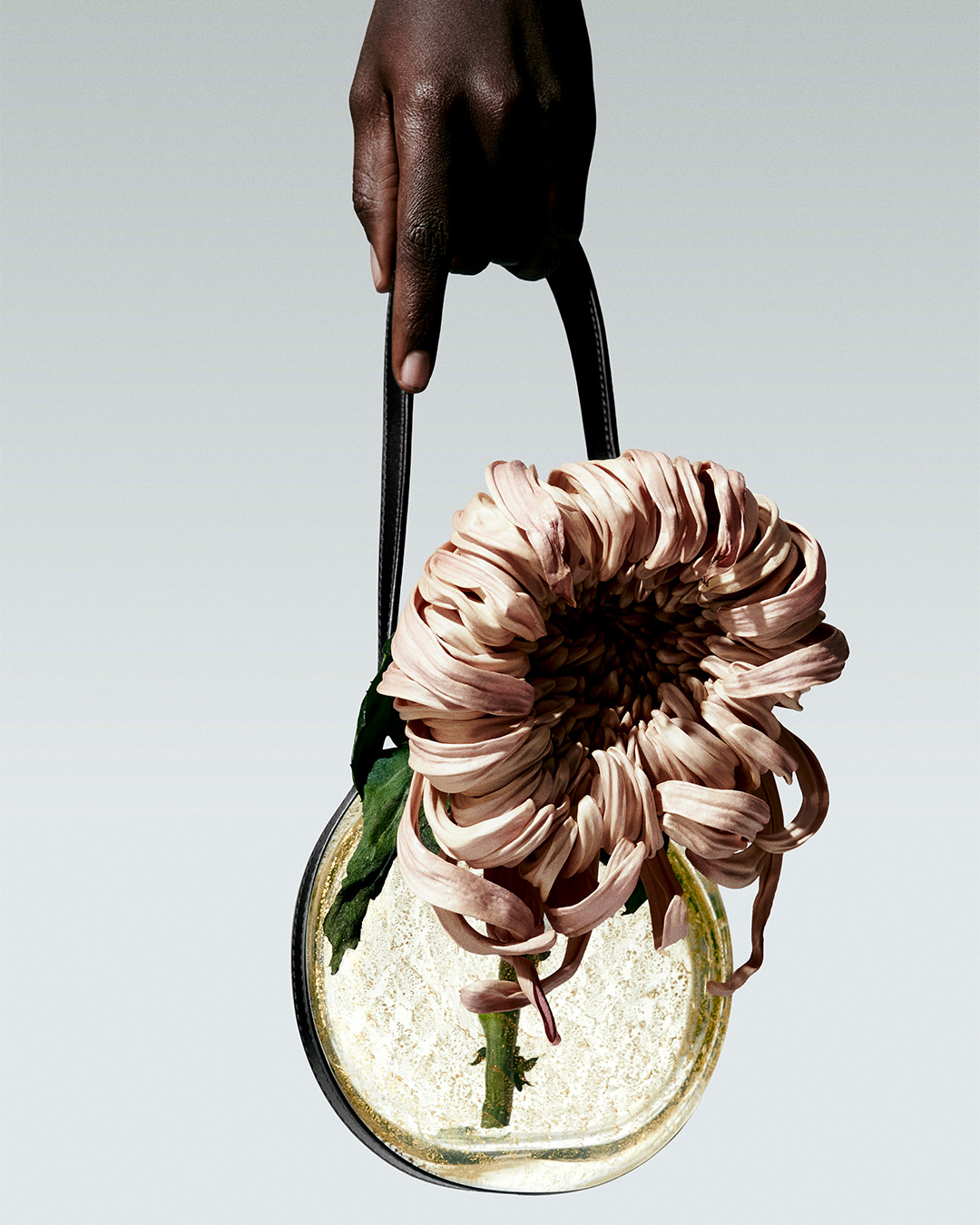 A detailed look at the texture and silhouette of a Loro Piana womenswear coat.