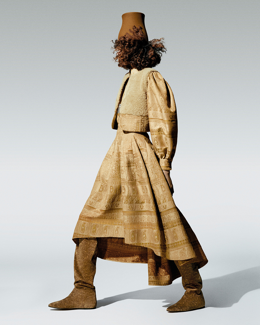 A model in a layered womenswear look from the Loro Piana Fall/Winter 2026 collection.