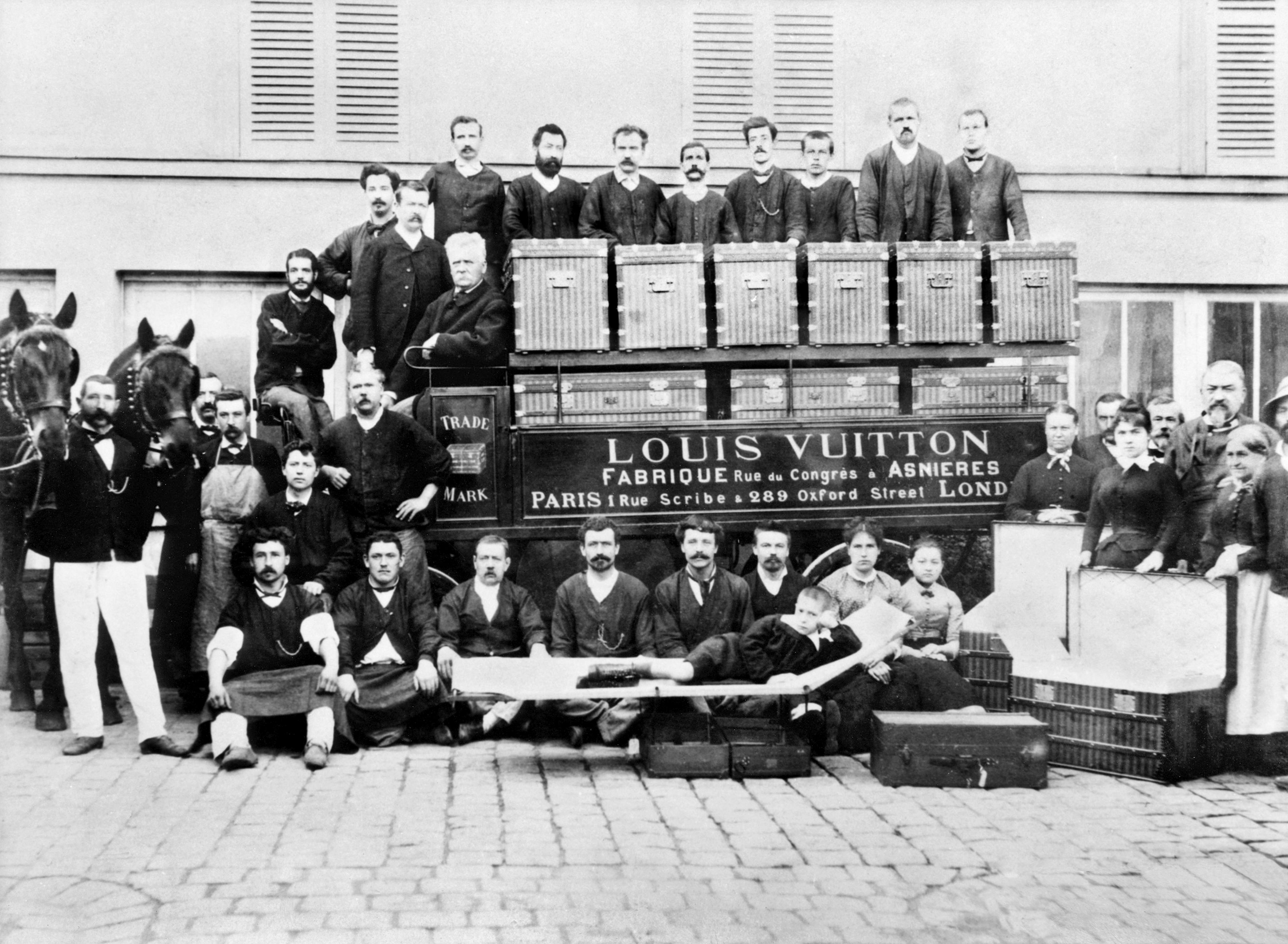 Louis, Georges and Gaston-Louis Vuitton (lying down on a trunk-bed) pose with factory workers in front of a horse-drawn delivery van. Asnières, 1888. © Archives Louis Vuitton Malletier