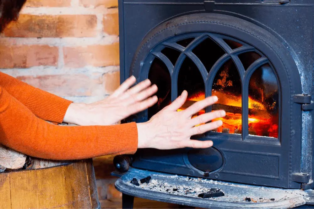warming hands on a fire