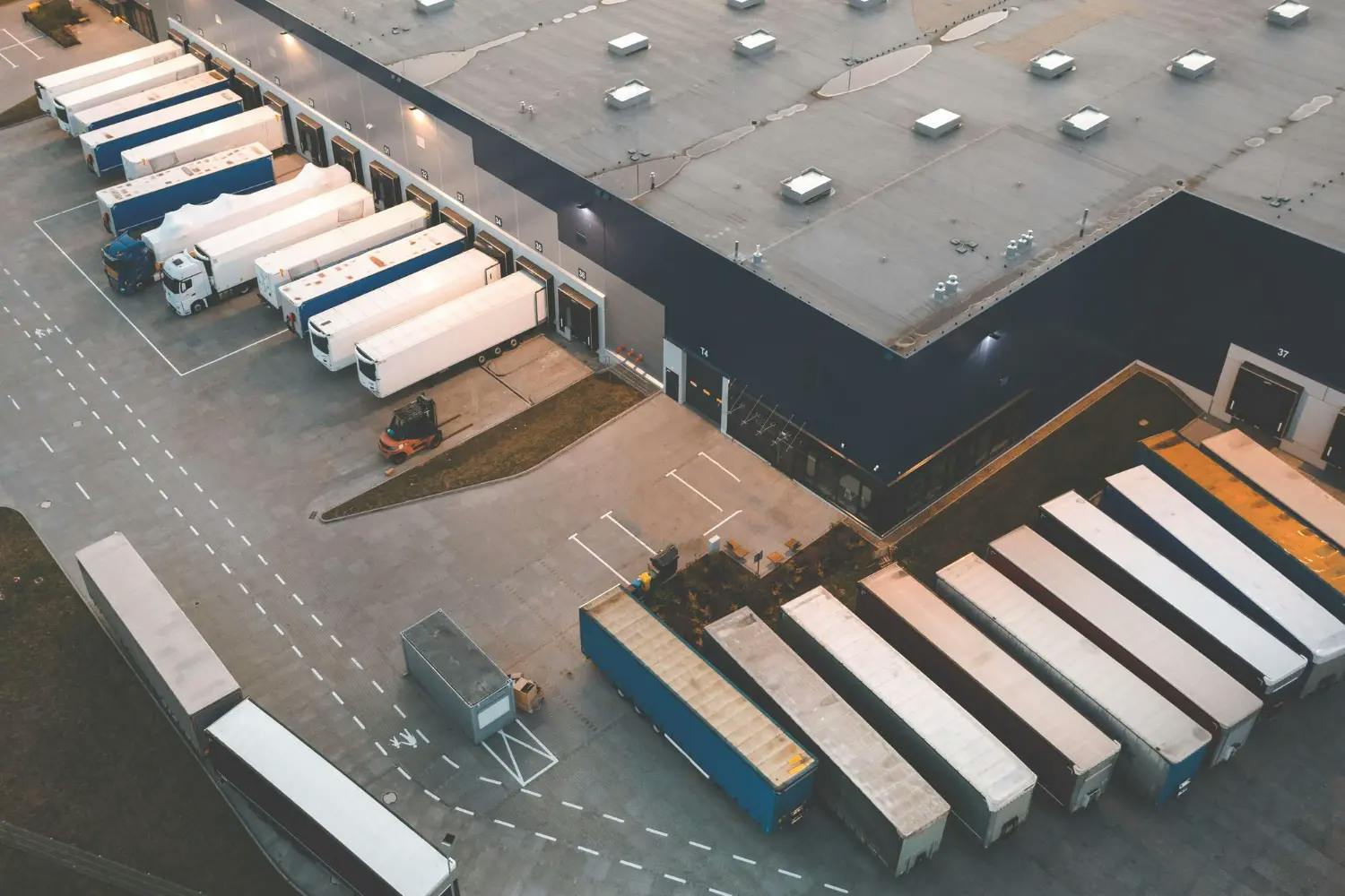 Aerial shot of warehouse with trucks