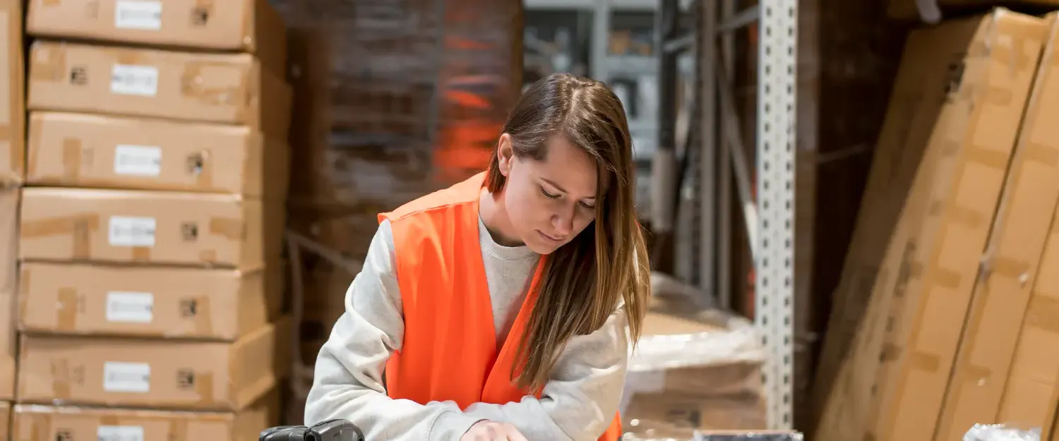 Woman at table in warehouse
