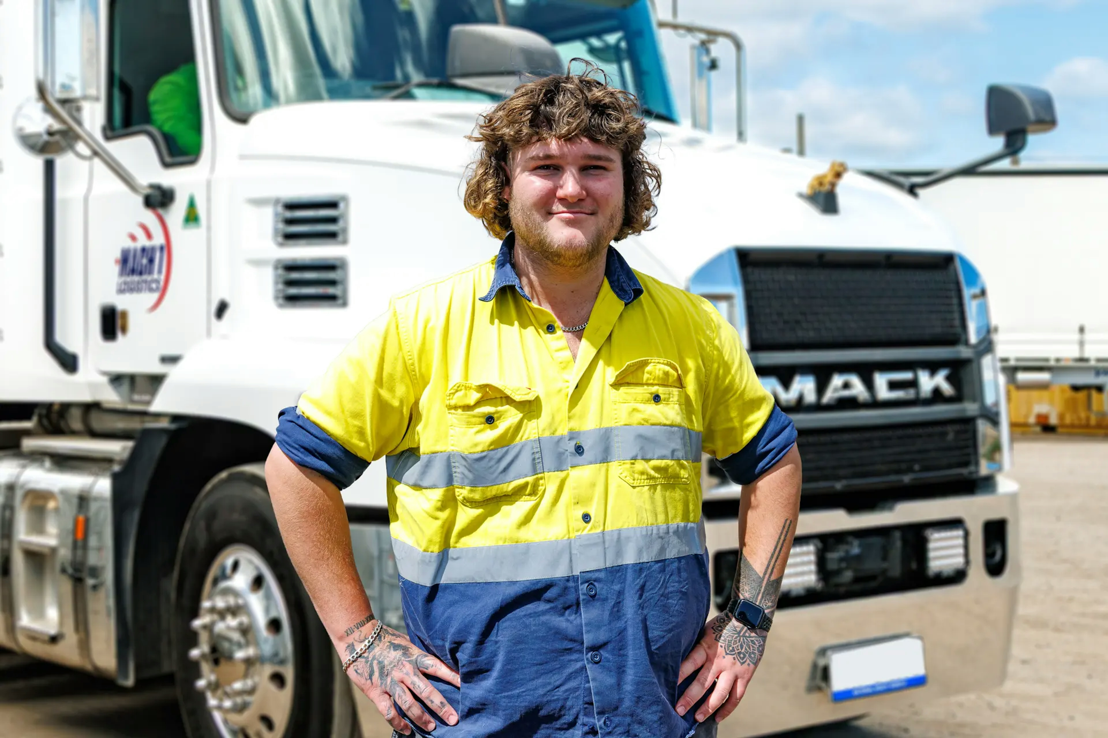 MACH 1 Staff member in front of truck