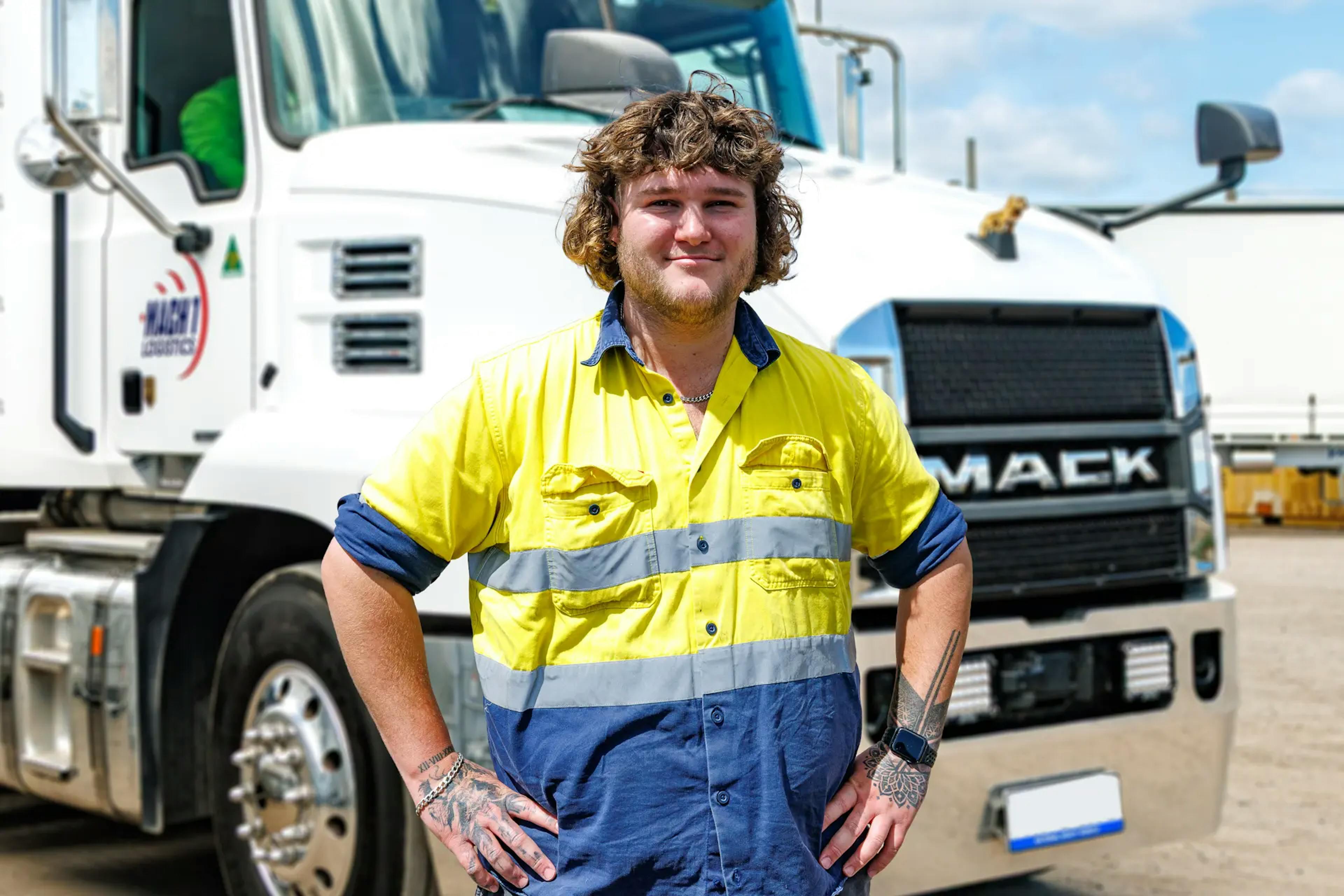 MACH 1 Staff member in front of truck