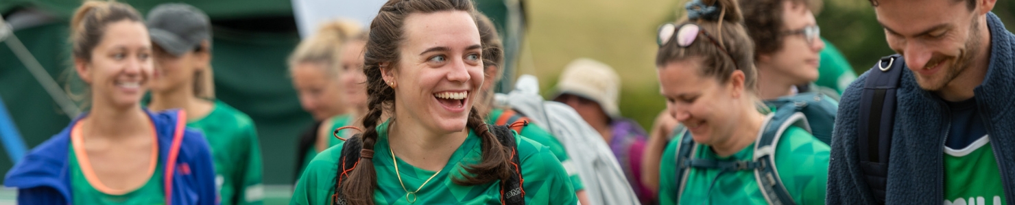Two hikers smiling while preparing for their Mighty Hike.
