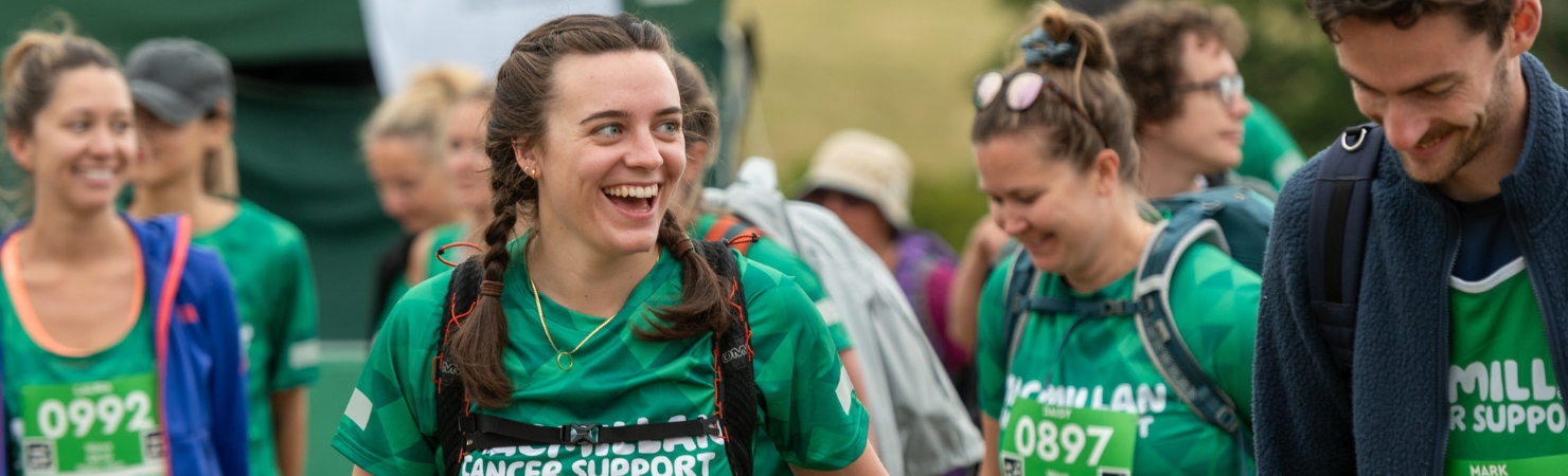 Two hikers smiling while preparing for their Mighty Hike.