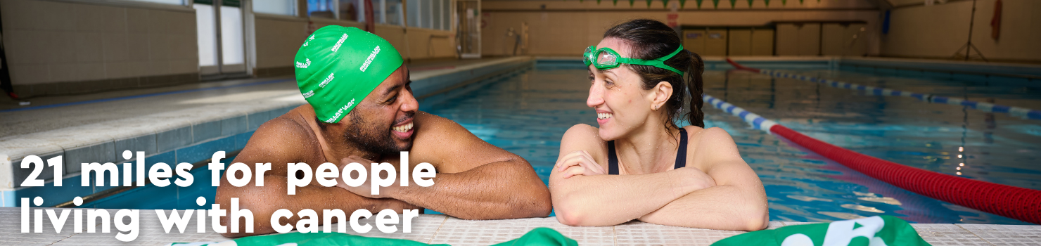 Swimmers smiling at each other in the pool, with text saying 21 miles for people living with cancer.