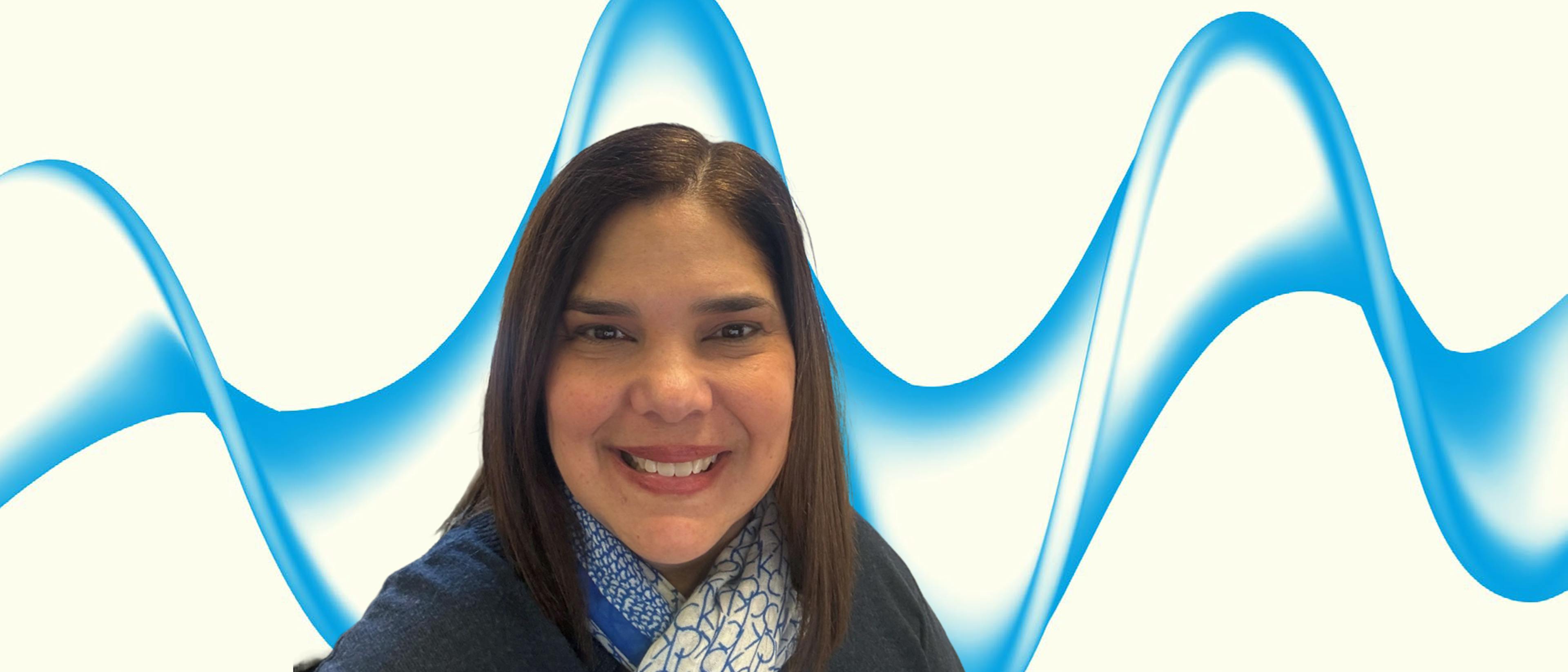 Head shot of a woman on a blue and white background