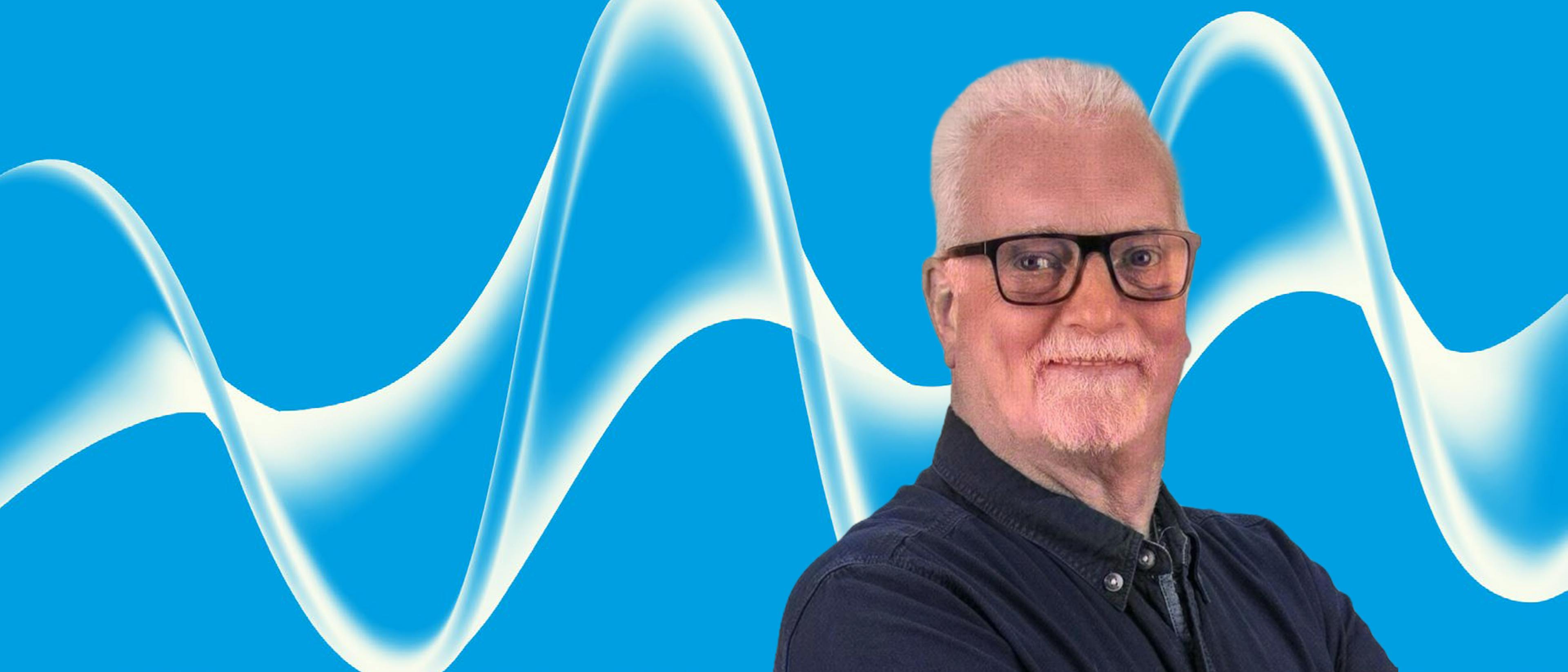 Image of male head shot with glasses on blue background