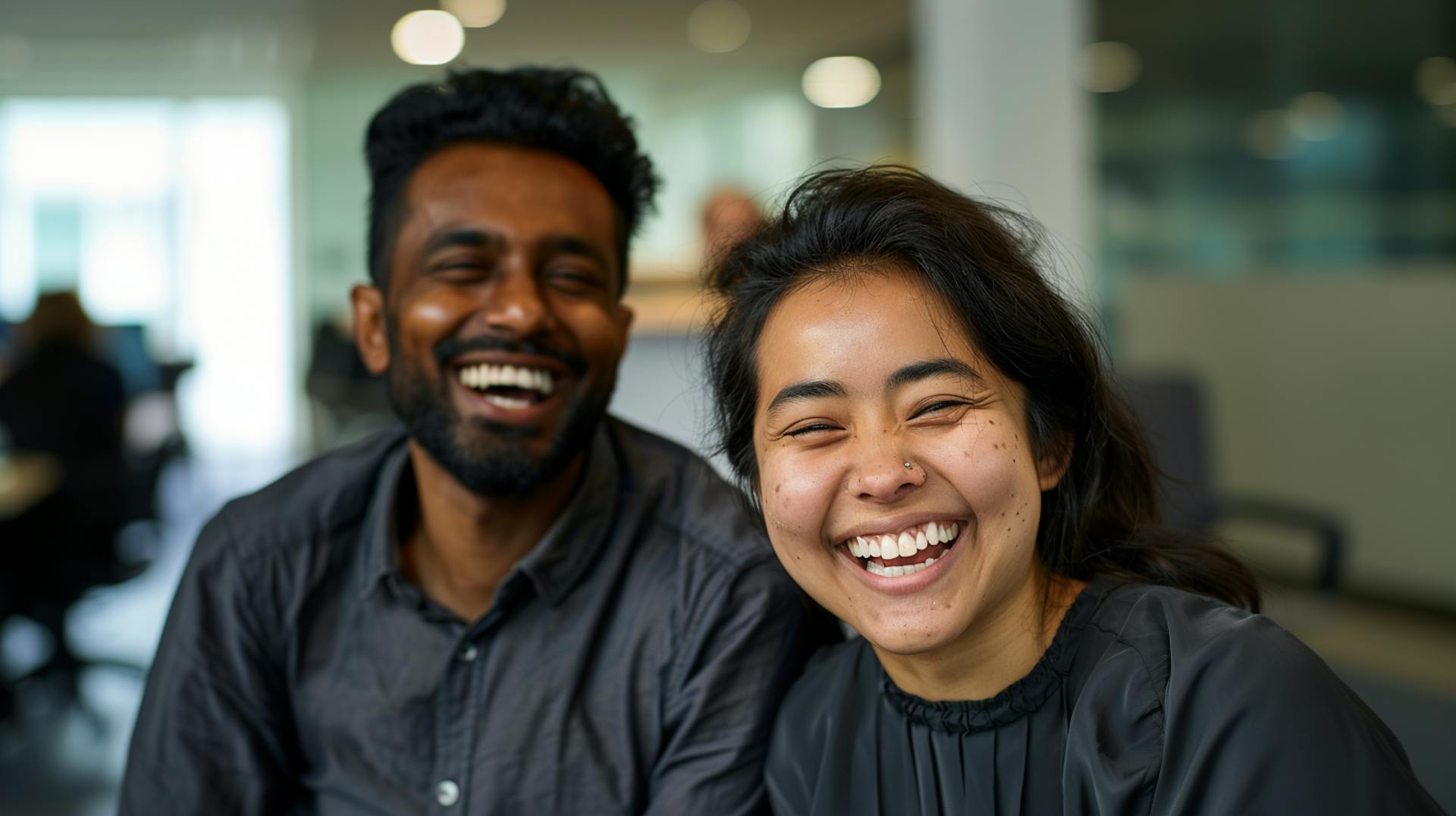 Image of two happy and laughing colleagues 