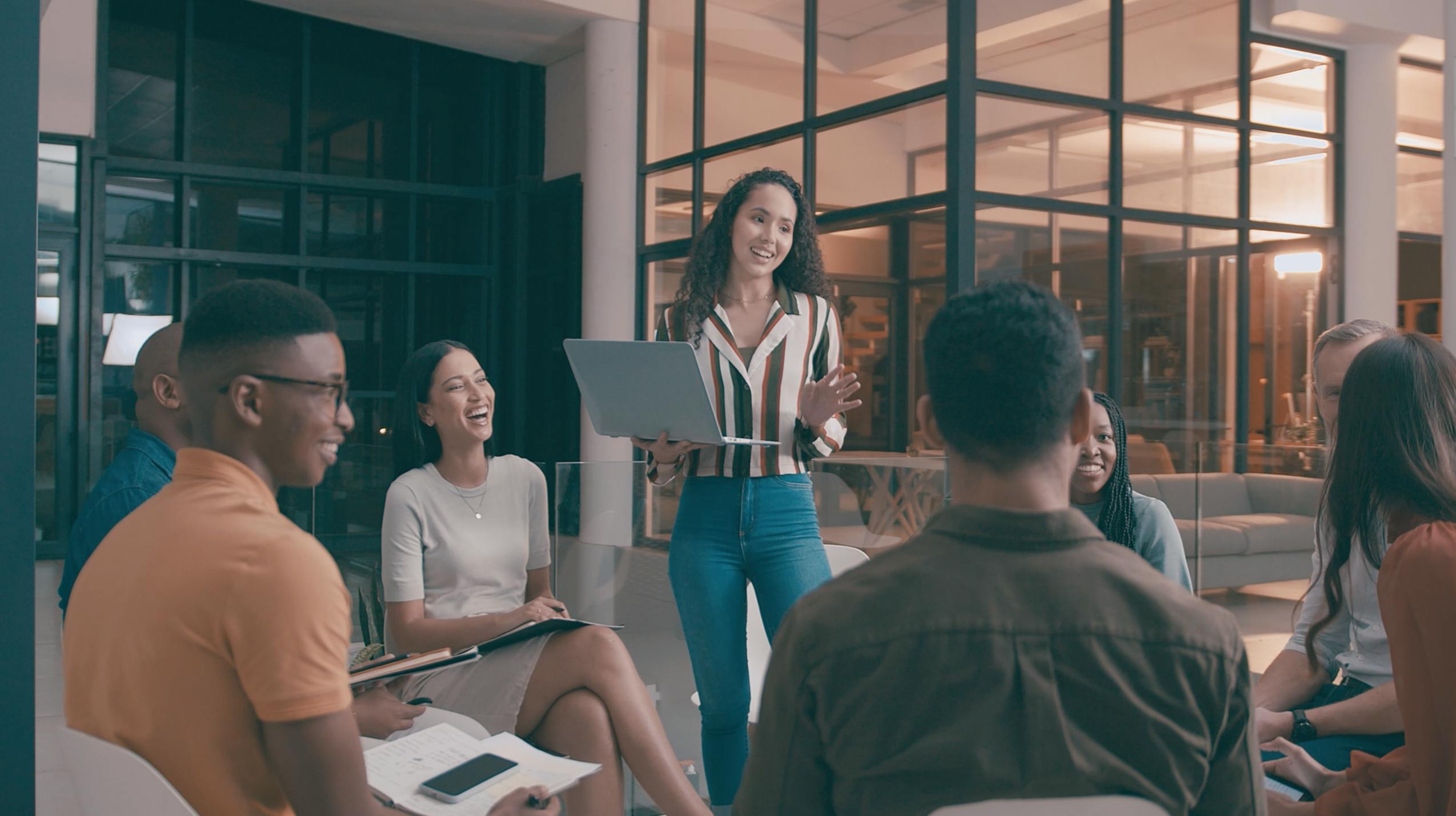 Group of co workers brainstorming in an office breakout area