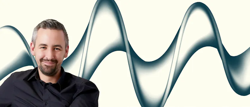 Image of a man in a black shirt on a cream background with grey wave

