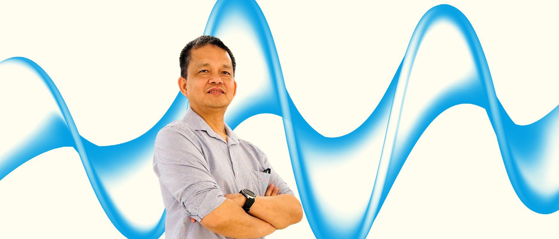 mage of a man in a blue shirt on a cream background