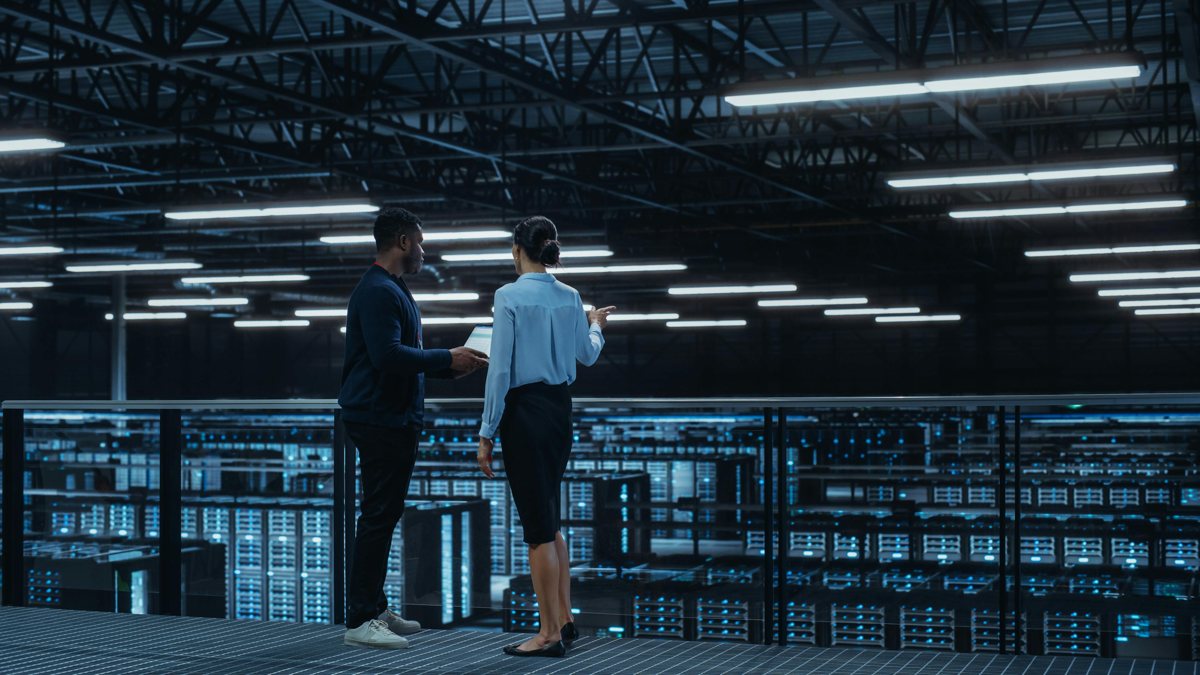 image of man and woman in a data centre