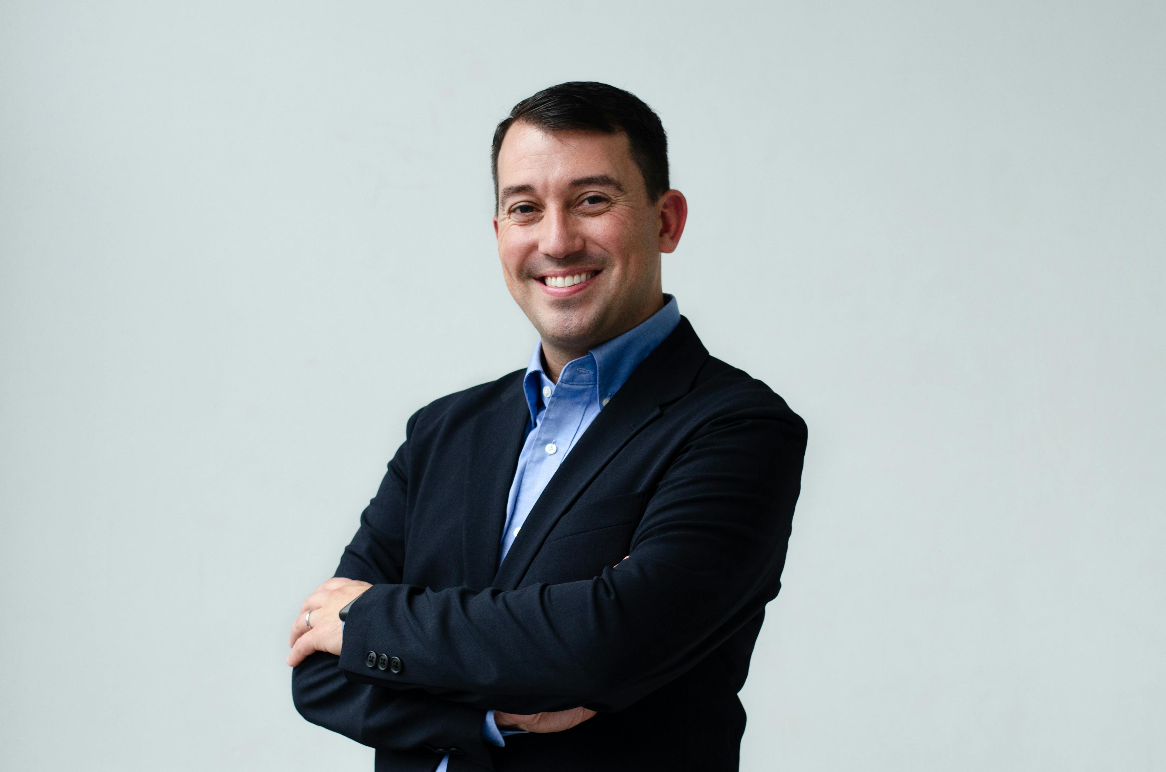 image of a man in a black blazer on a white background