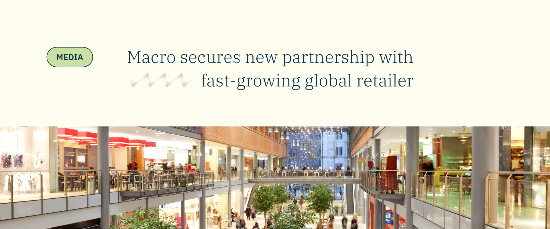 cream banner with image of retail centre and blue text