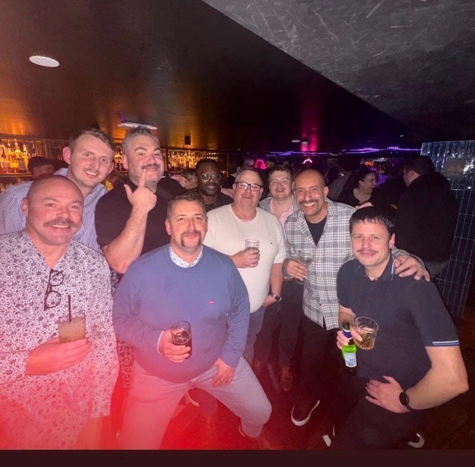 group of men with mos for movember