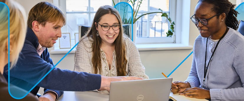 image of men and women looking at a laptop