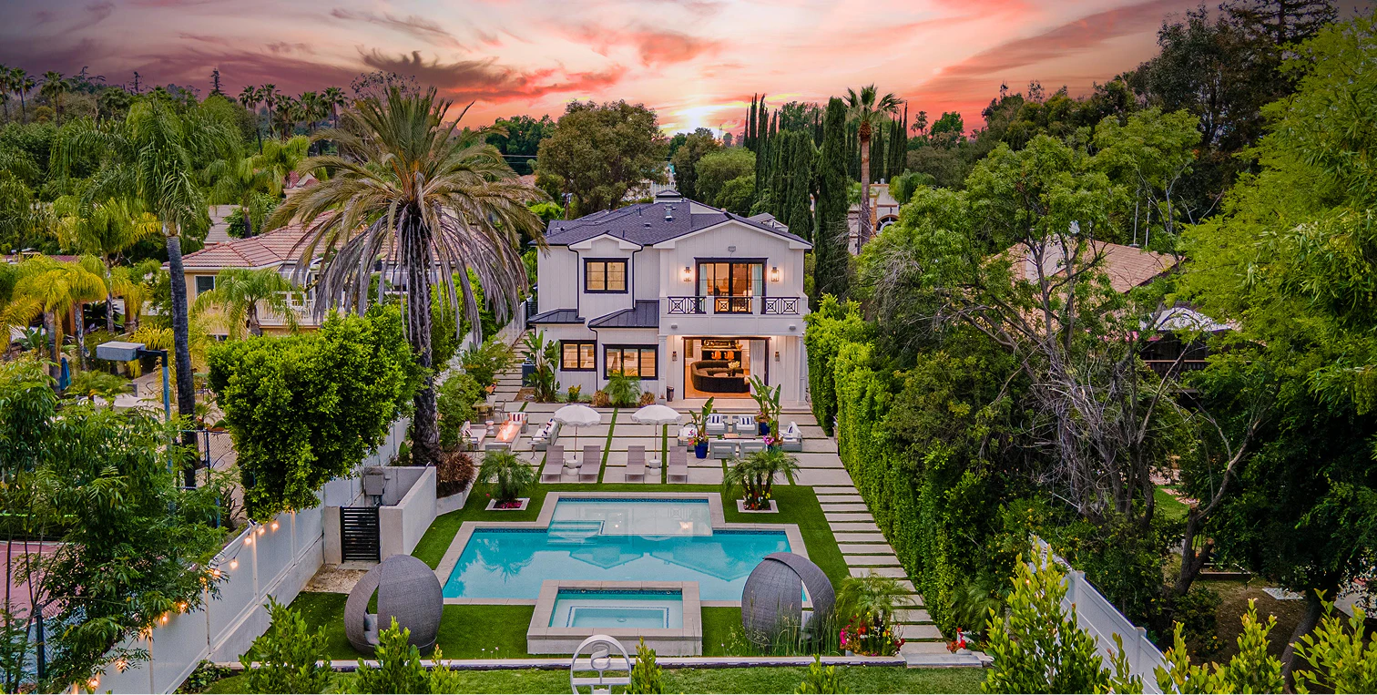 Luxury Malibu estate at sunset with infinity pool overlooking the coast