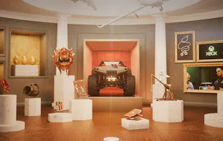 A room filled with 3D items that are referencing to the 20 year history of xbox.