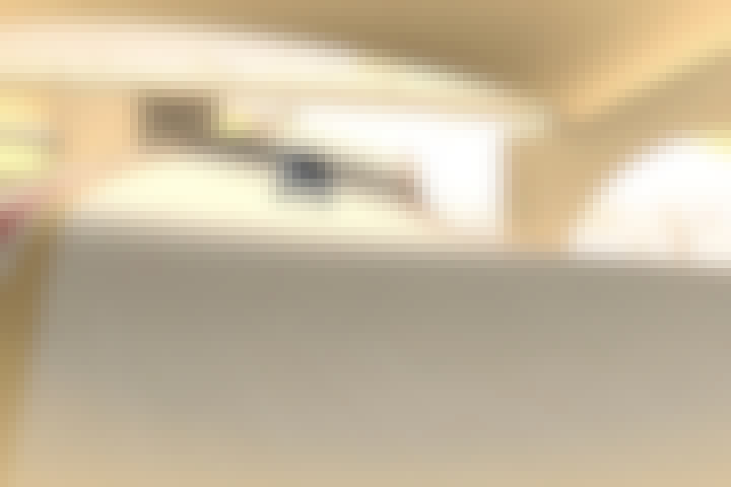 White Renault Twingo driving far behind