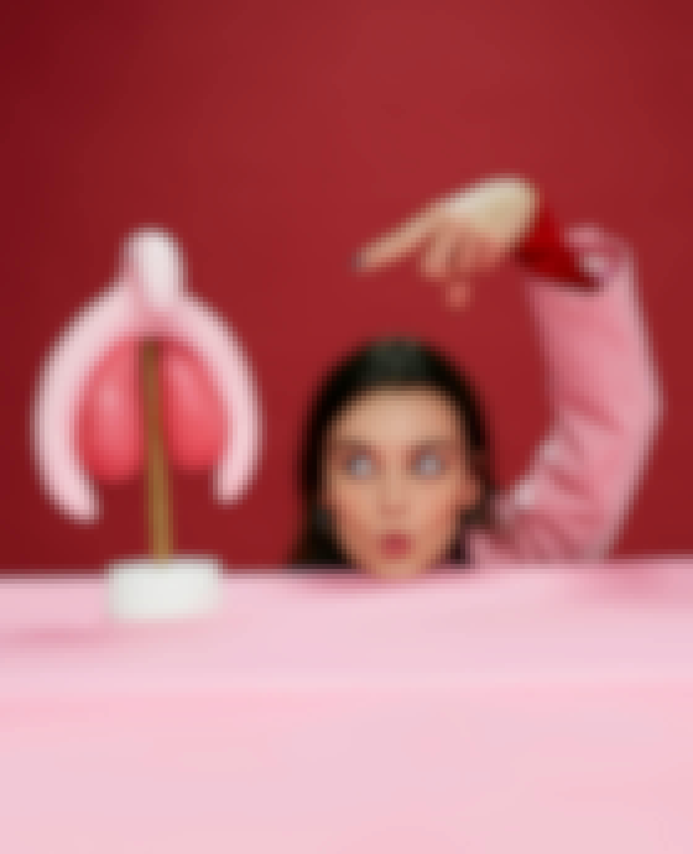 Emma Mackey with a model of a clitoris