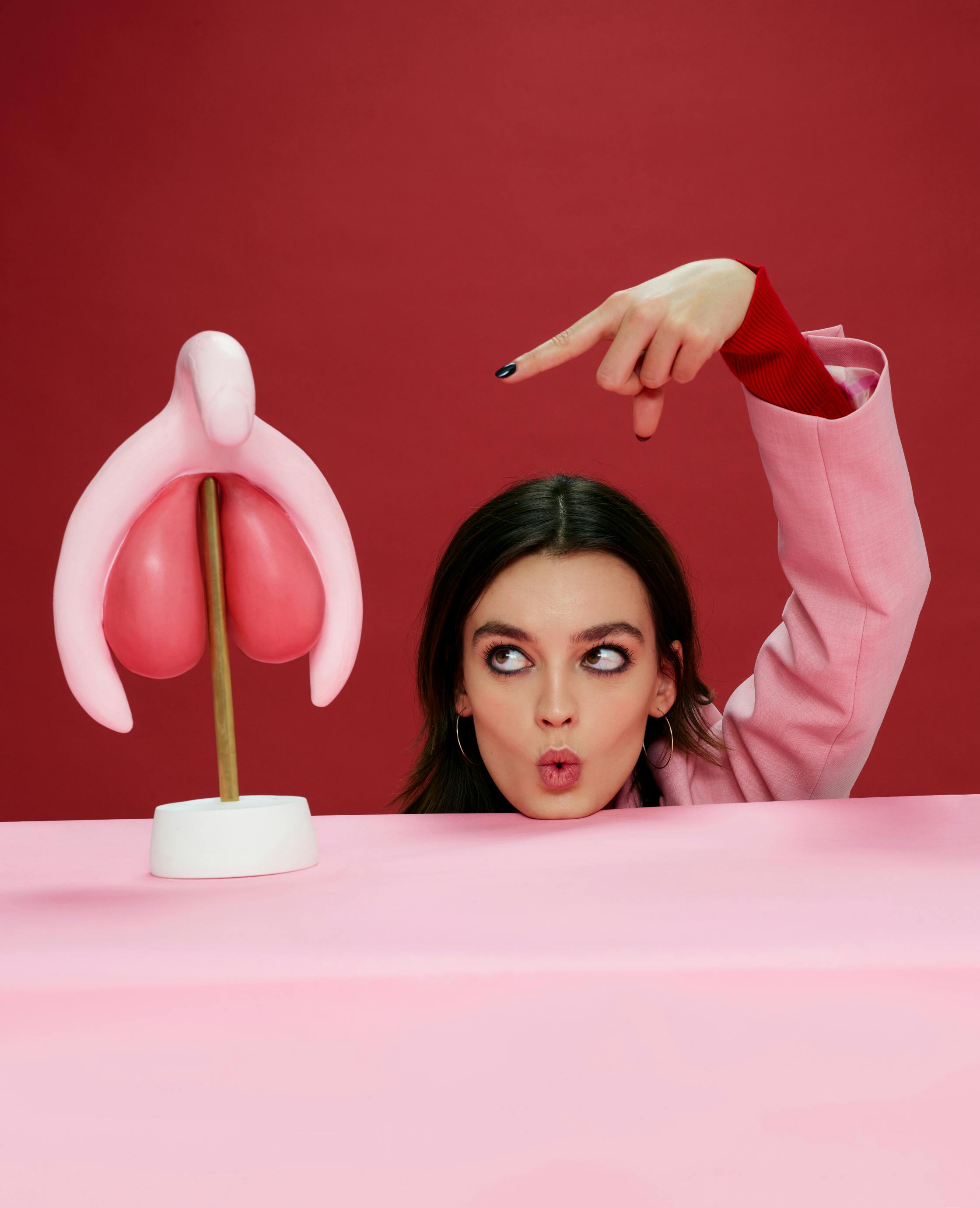 Emma Mackey with a model of a clitoris