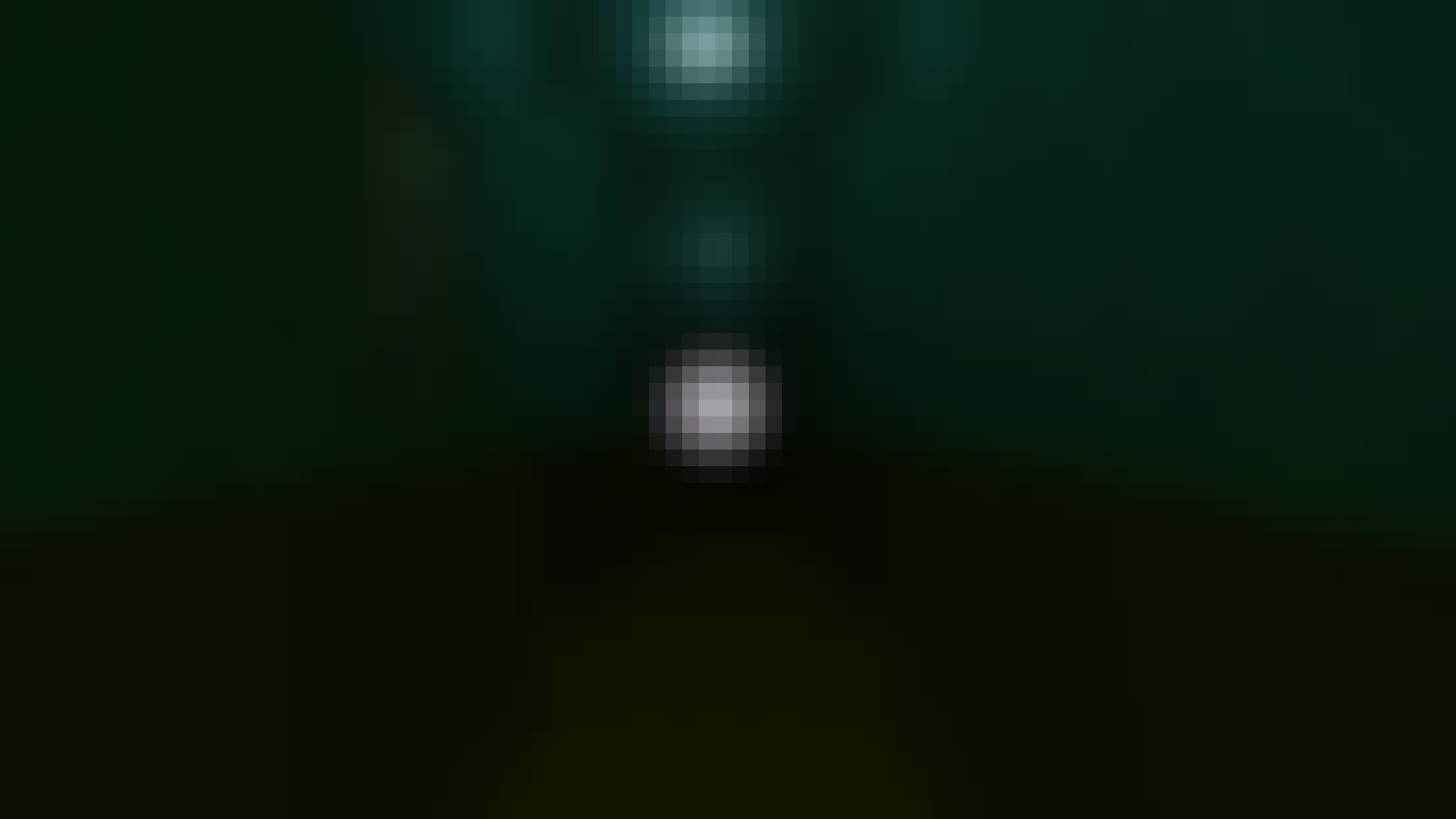 Bulb of light inside a dark corridor.
