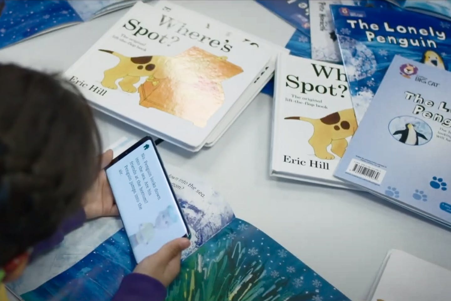 Child with Storysign reading books